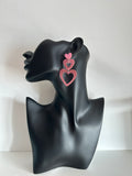 Pendientes de corazones rosa con brillos