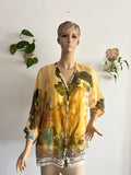 👚 Blusa vaporosa en tonos amarillos con estampado artístico 🎨💛